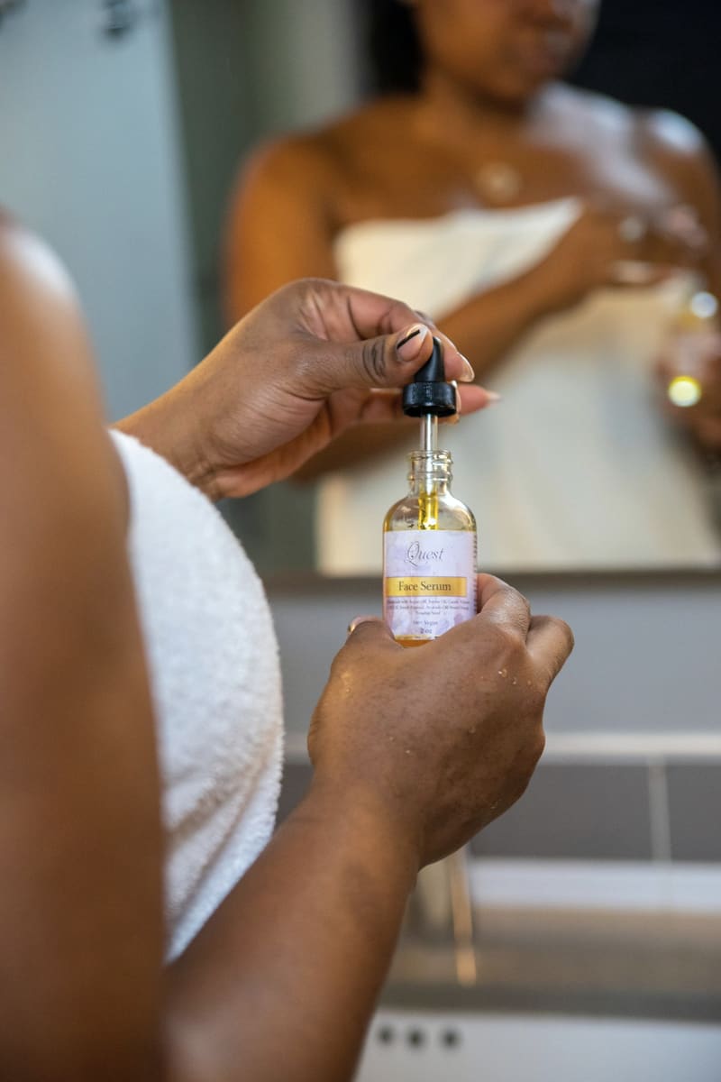A hydrating serum being measured out before a facial