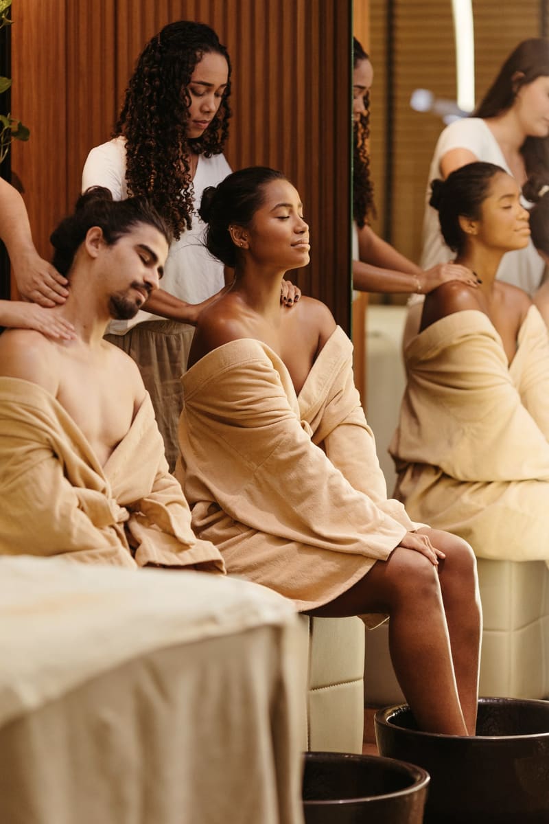 Women together in robes at a wellness studio