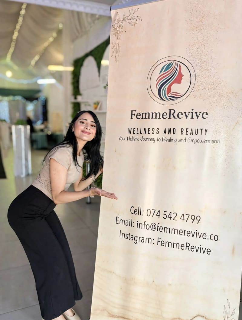Mishkaah Noorbhai beside the FemmeRevive banner